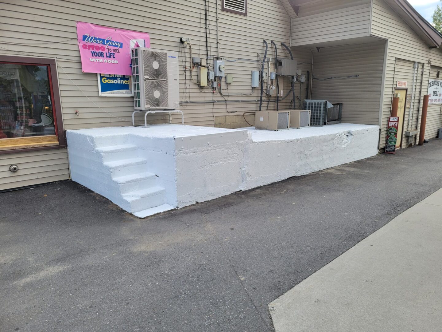 A large white sheet of plastic sitting outside.