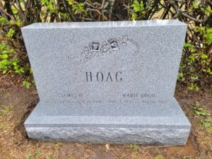 A grave marker with the name hoag engraved on it.